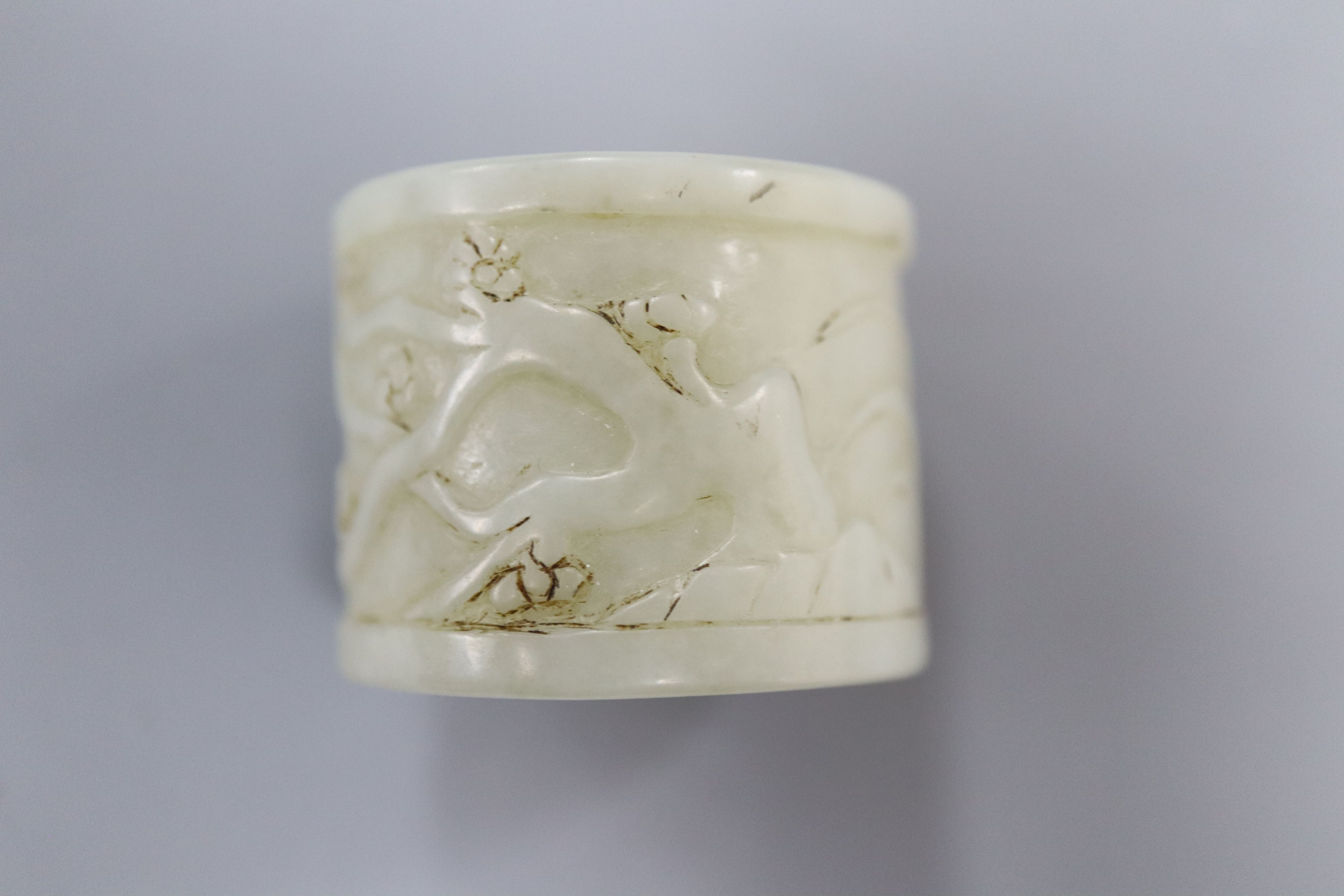 A Chinese pale celadon jade archers thumb ring